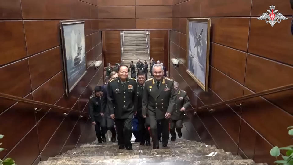 In this photo taken from video released by Russian Defense Ministry Press Service, Gen. Zhang Youxia, vice chairman of China's Central Military Commission, center left, and Russian Defense Minister Sergei Shoigu, center right, walk to attend the talks in Moscow, Russia, Wednesday, Nov. 8, 2023. (Russian Defense Ministry Press Service via AP)