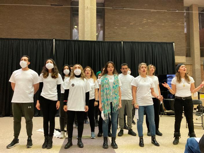 Iranian students perform a popular protest song, &quot;Baraye,&quot; at the UW-Milwaukee Student Union on Nov. 15. The students also performed a skit depicting how Iranian government forces harass women as part of a demonstration against the regime.