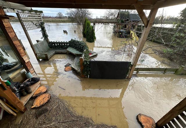 David Walters of his home in flood water. 