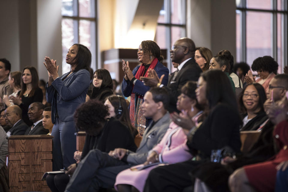 People react as Rev. Raphael G. Warnock speaks during the Martin Luther King, Jr. annual commemorative service at Ebenezer Baptist Church in Atlanta on Monday, Jan. 20, 2020. (Branden Camp/Atlanta Journal-Constitution via AP)