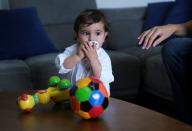 Baby George Khnaisser, whose mother was in labour at the moment of the last year's Beirut port blast is pictured at the family home in Jal el-Dib