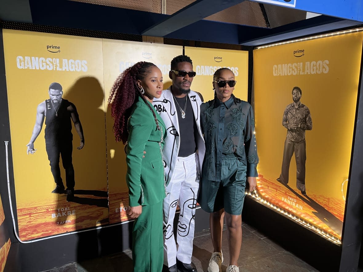 Adesua Etomi-Wellington (L), Tobi Bakre (C), and Chioma Akpotha (R) pose at the New York City premiere of their Amazon Studios original film, Gangs of Lagos, on April 13, 2023. (theGrio Photo/Chinekwu Osakwe)