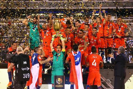 Jun 26, 2016; East Rutherford, NJ, USA; Chile celebrates after winning the championship match of the 2016 Copa America Centenario soccer tournament against Argentina at MetLife Stadium. Chile defeated Argentina 0-0 (4-2). Mandatory Credit: Brad Penner-USA TODAY Sports