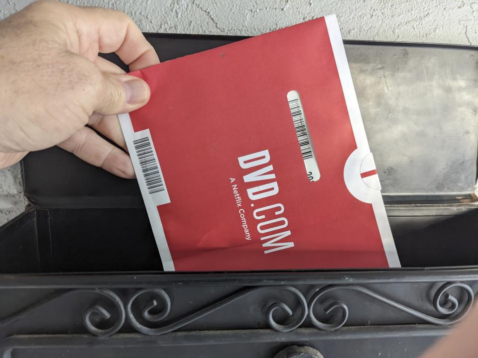 A Netflix DVD envelope is shown on Nov. 17, 2022 in San Francisco. Subscribers to Netflix’s DVD-by-mail service still look forward to opening up their mailbox and finding one of the discs delivered in the familiar red-and-white envelopes. (AP Photo/Michael Liedtke)