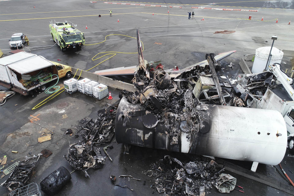 This photo, provided by the National Transportation Safety Board, shows damage from a World War II-era B-17 bomber plane that crashed on Oct. 2, 2019, at Bradley International Airport in Windsor Locks, Conn. Pilot error was the probable cause of the 2019 crash that killed seven people and wounded six others, the National Transportation Safety Board said in a report released Tuesday, April 13, 2021, that also cited inadequate maintenance as a contributing factor. (NTSB via AP, File)