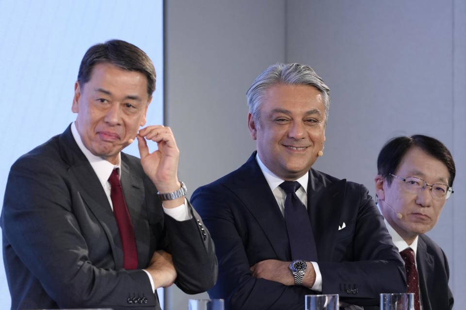 Makoto Uchida CEO of Nissan, left, Luca de Meo CEO of Renault Group, centre, and Takao Kato CEO of Mitsubishi Motors, right, listen during a Renault Nissan Mitsubishi press conference in London, Monday, Feb. 6, 2023. The boards of Renault and Nissan have approved equalizing the stake each automaker holds in the other, bringing a better balance in the French-Japanese alliance. Under the decision announced Monday, both companies will own 15% in the other. (AP Photo/Kirsty Wigglesworth)