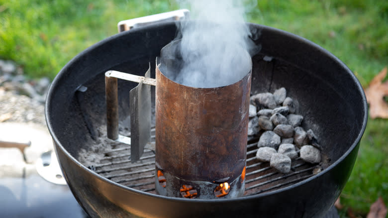 Barbecue chimney starter smoking