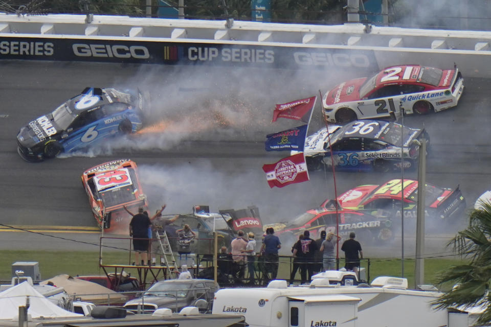 Cars collide in 13th lap during the NASCAR Daytona 500 auto race at Daytona International Speedway, Sunday, Feb. 14, 2021, in Daytona Beach, Fla. (AP Photo/Chris O'Meara)