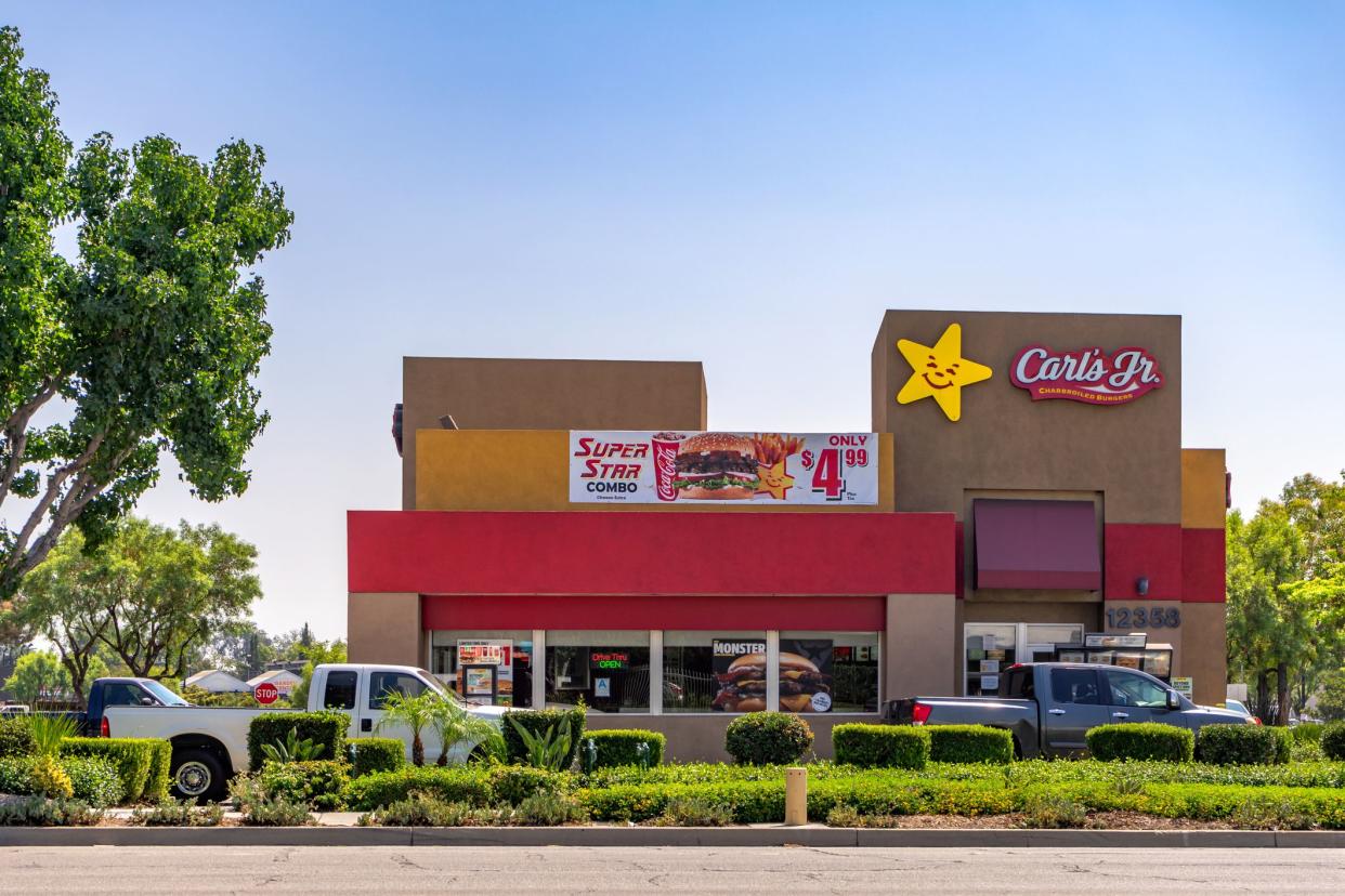 Whittier, CA / USA – September 3, 2020: Exterior view of a Carl’s Jr. restaurant with a drive thru on Washington Blvd. in the City of Whittier, California.