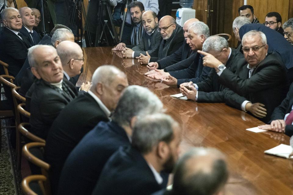 FILE - Fatah and Hamas officials wait for a meeting with Russian Foreign Minister Sergei Lavrov and representatives of Palestinian groups and movements in Moscow, Russia, Tuesday, Feb. 12, 2019. Several Hamas leaders have visited Russia, which has sought to maintain contacts with the group. The war between Israel and Hamas offers Moscow new opportunities — to advance its role as a global power broker and break out of its isolation over Ukraine. (AP Photo/Pavel Golovkin, Pool, File)