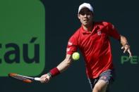 Mar 29, 2017; Miami, FL, USA; Kei Nishikori of Japan hits a forehand against Fabio Fognini of Italy (not pictured) on day nine of the 2017 Miami Open at Crandon Park Tennis Center. Fognini won 6-4, 6-2. Geoff Burke-USA TODAY Sports