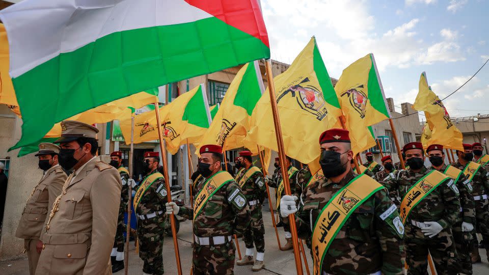 Members of the Hezbollah brigades, Kataib Hezbollah, attend the funeral of Fadel al-Maksusi, a fighter who was also part of the "Islamic resistance in Iraq", the group that has claimed all recent attacks against US troops in Iraq and Syria, in Baghdad on November 21, 2023. - Ahmad Al-Rubaye/AFP/Getty Images