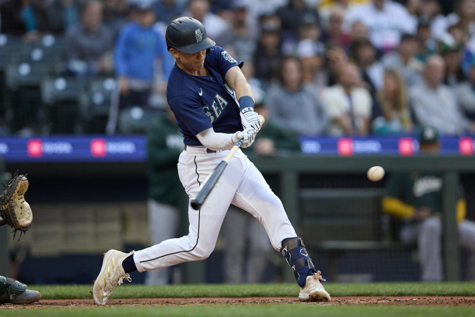 Seattle Mariners' Sam Haggerty hits a two-run double against the Oakland Athletics during the fourth inning of a baseball game Wednesday, May 24, 2023, in Seattle. (AP Photo/John Froschauer)