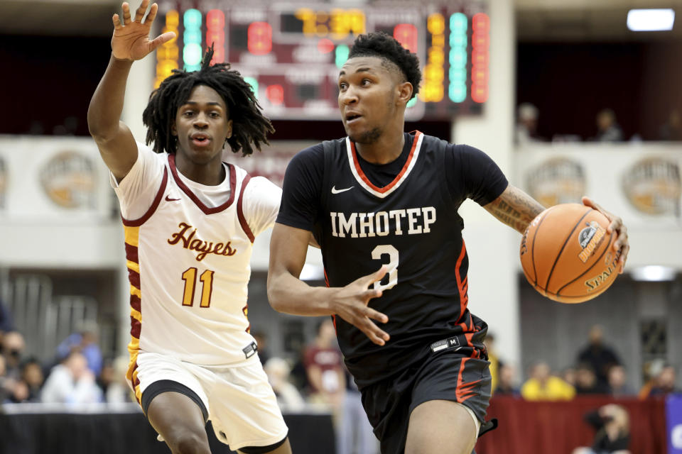 FILE - Imhotep's Justin Edwards (3) drives against a Cardinal Hayes player during a high school basketball game at the Hoophall Classic, Sunday, Jan. 15, 2023, in Springfield, Mass. Kentucky has three of the nation’s top five prospects according to the 247Sports Composite in Edwards (3rd), center Aaron Bradshaw (5th) and guard DJ Wagner (6th). (AP Photo/Gregory Payan, File)