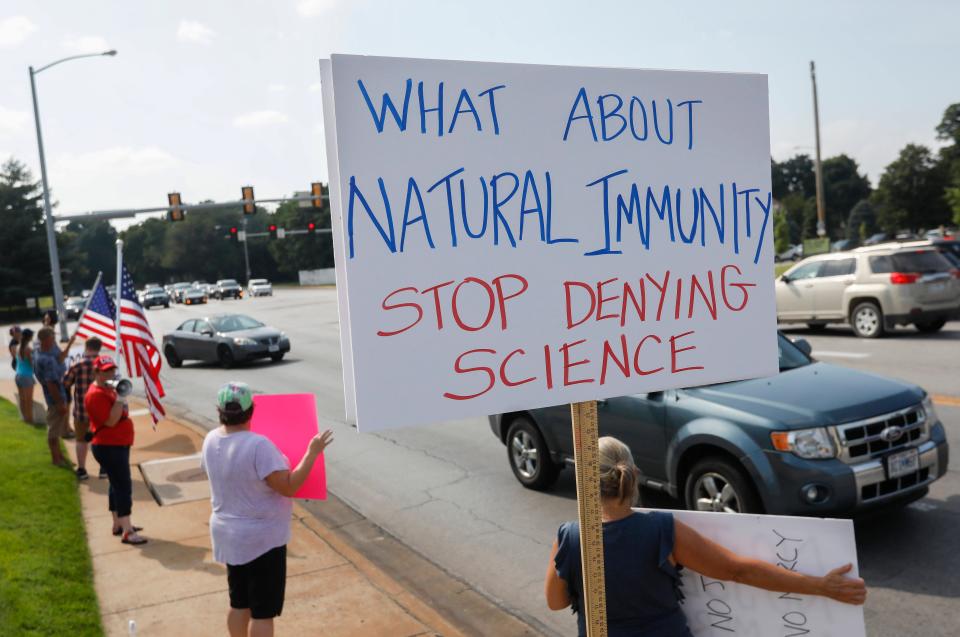 Protesters object to a requirement that employees at Mercy Hospital in Springfield, Missouri, get vaccinated against COVID-19.