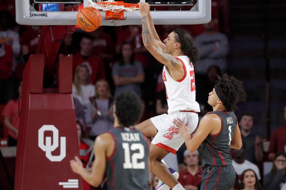 Texas Tech Red Raiders guard Jaylon Tyson (20) dunks the ball beside Oklahoma Sooners forward Jalen Hill (1) during a men's college basketball game between the University of Oklahoma Sooners (OU) and Texas Tech at Lloyd Noble Center in Norman, Okla., Tuesday, Feb. 21, 2023. Texas Tech won 74-63.