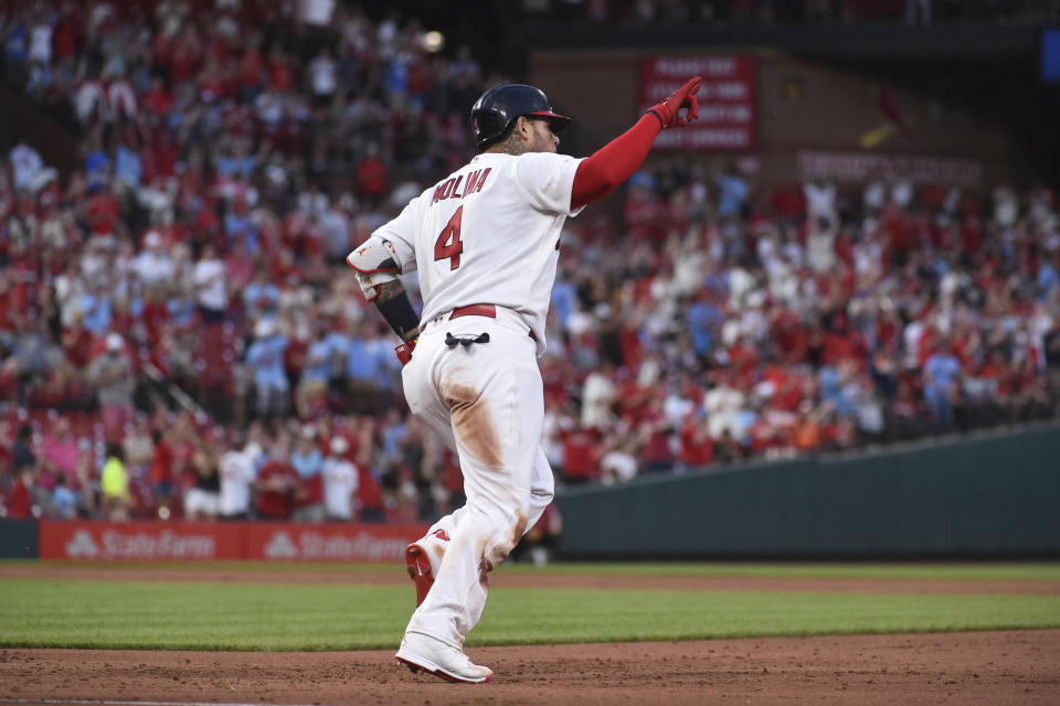 St. Louis Cardinals' Yadier Molina (4) reacts while rounding the bases after hitting a two-run home run during the fifth inning of a baseball game against the San Francisco Giants on Sunday, May 15, 2022, in St. Louis. (AP Photo/Joe Puetz)