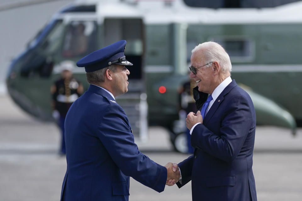 President Joe Biden greets Col. Stephen R. Gwinn, 103rd Airlift Wing Commander, as he arrives at Bradley International Airport, Friday, Oct. 15, 2021, in Windsor Locks, Conn. (AP Photo/Evan Vucci)