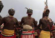 Turkana men dance and sing during the hybrid solar eclipse at the remote Sibiloi National Park on the shores of Lake Turkana, November 3, 2013. REUTERS/Noor Khamis (KENYA - Tags: ENVIRONMENT SOCIETY)