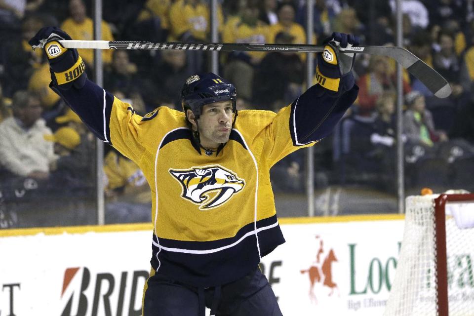 FILE - In this Jan. 12, 2014 file photo, Nashville Predators center David Legwand warms up to play against the Minnesota Wild in an NHL hockey game in Nashville, Tenn. The Nashville Predators announced Wednesday, Feb. 5, 2014 that they have traded away their first draft pick, sending forward David Legwand back to his hometown Detroit. The Predators got Patrick Eaves, a prospect and a third-round draft pick in exchange for Legwand. (AP Photo/Mark Humphrey, File)