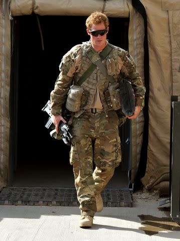 <p>John Stillwell - WPA Pool/Getty Images</p> Prince Harry at Camp Bastion in Afghanistan