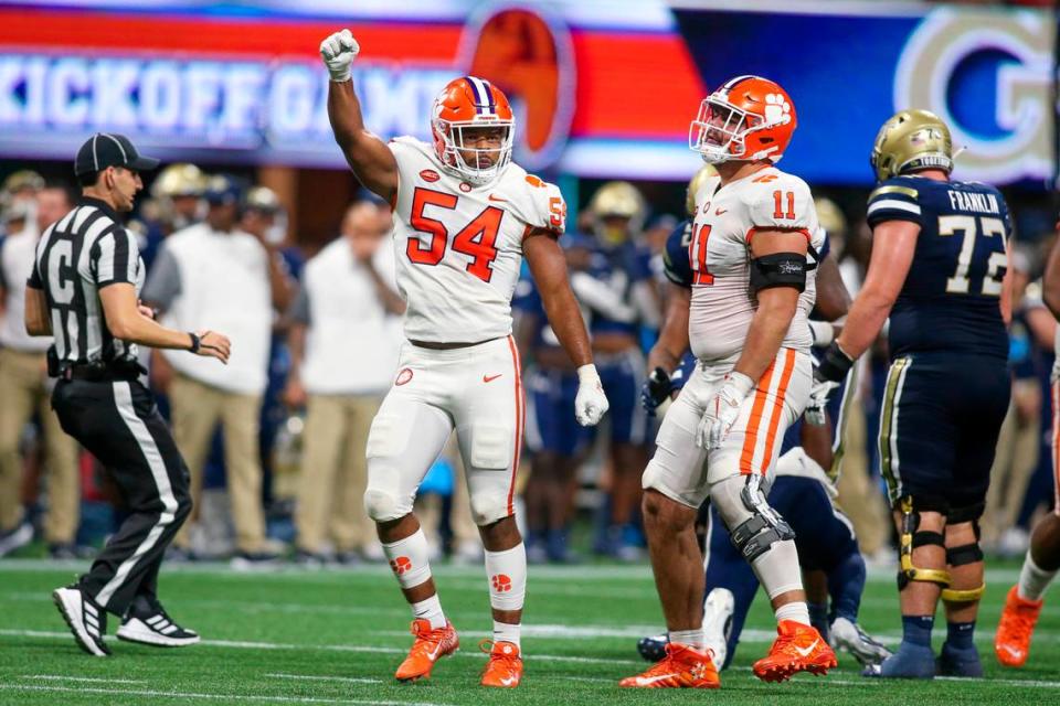 Sep 5, 2022; Atlanta, Georgia, USA; Clemson Tigers linebacker Jeremiah Trotter Jr. (54) and defensive tackle Bryan Bresee (11) celebrate after a stop on third down against the Georgia Tech Yellow Jackets in the second half at Mercedes-Benz Stadium. Mandatory Credit: Brett Davis-USA TODAY Sports