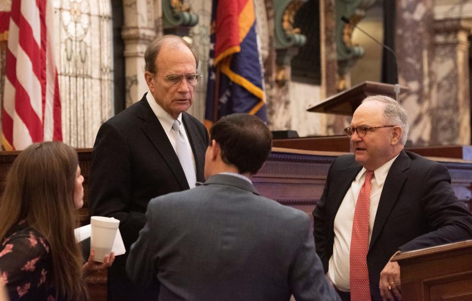 Lt. Gov. Delbert Hosemann, second from left, speaks with staff members after adjourning on the opening day of the 2023 legislative session at the state Capitol in Jackson, Miss., Tuesday, Jan. 3, 2023.