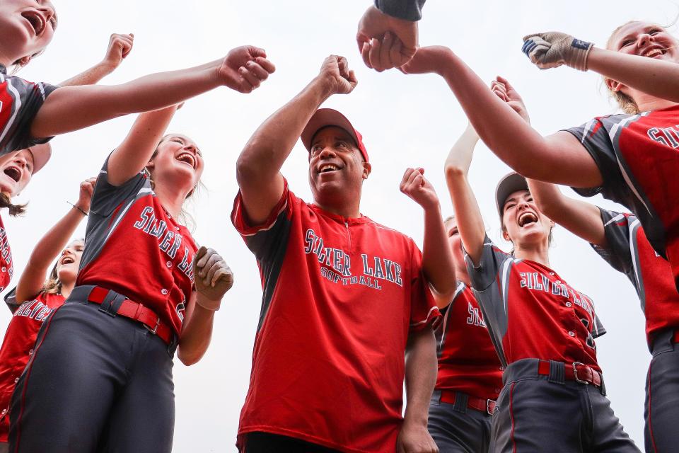 From left, Silver Lake's Hannah Selig, coach Tony Pina and Samantha Waters celebrate after a game against Oliver Ames in the Div. 2 Round of 32 on Tuesday, June 6, 2023.