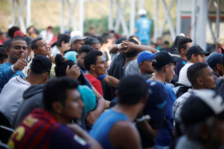 Migrants from Honduras, part of a new caravan from Central America trying to reach the United States, wait to be processed in an immigration facility in Ciudad Hidalgo, Mexico, January 17, 2019. REUTERS/Jose Cabezas