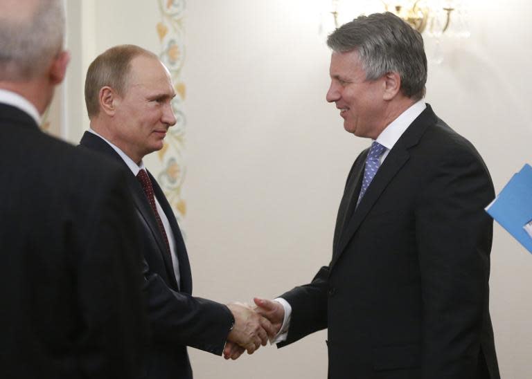 Vladimir Putin (left) welcomes Royal Dutch Shell CEO Ben van Beurden to the president's Novo-Ogaryovo residence outside Moscow, on April 18, 2014