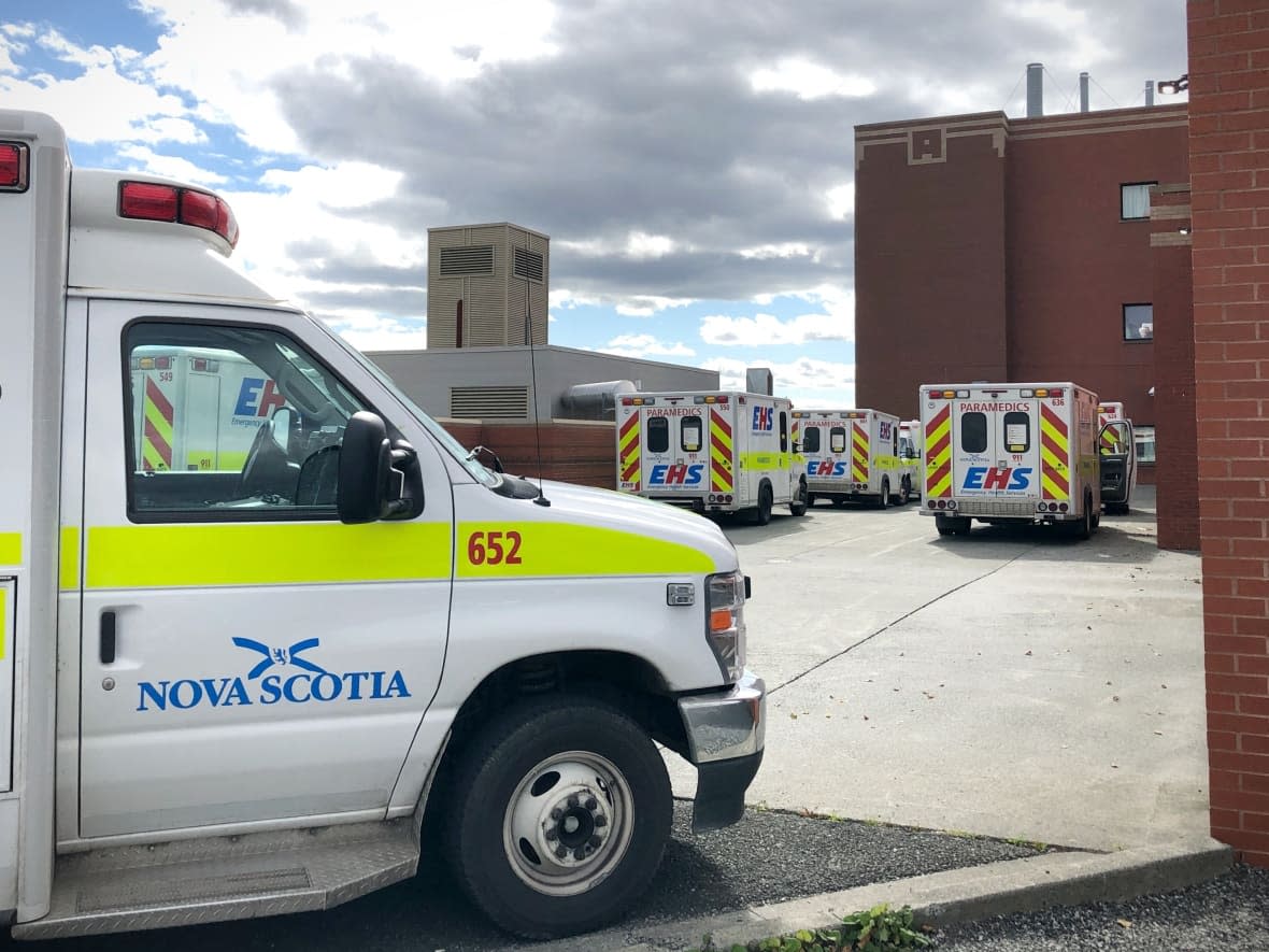 Ambulances are seen outside the Cape Breton Regional Hospital. While there are an estimated 27 paramedic vacancies in Nova Scotia, the union says there could really be 200 openings because so many people are on sick leave.  (Tom Ayers/CBC - image credit)