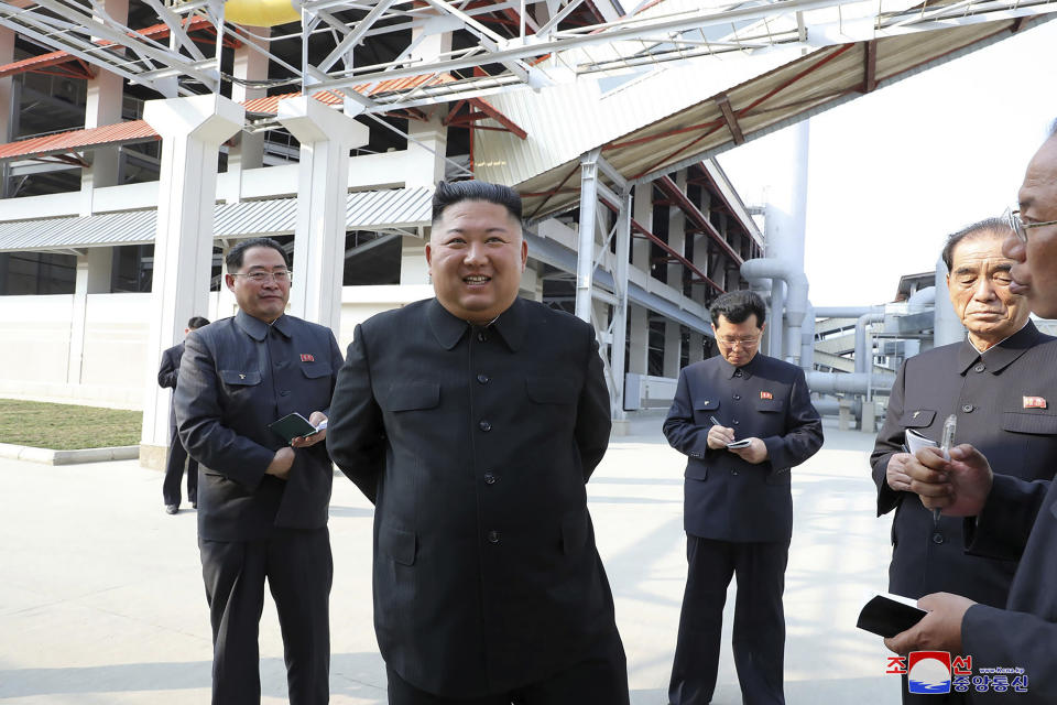 ADDING CITY - In this Friday, May 1, 2020, photo provided by the North Korean government, North Korean leader Kim Jong Un, center, visits a fertilizer factory in Sunchon, South Pyongan province, near Pyongyang, North Korea. Kim made his first public appearance in 20 days as he celebrated the completion of the fertilizer factory, state media said Saturday, May 2, 2020, ending an absence that had triggered global rumors that he may be seriously ill. Independent journalists were not given access to cover the event depicted in this image distributed by the North Korean government. The content of this image is as provided and cannot be independently verified. Korean language watermark on image as provided by source reads: "KCNA" which is the abbreviation for Korean Central News Agency. (Korean Central News Agency/Korea News Service via AP)