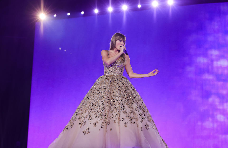 Taylor Swift sings 'Enchanted' in ballgown on stage