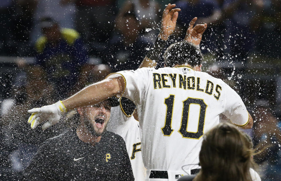 Aug 3, 2022; Pittsburgh, Pennsylvania, USA; Pittsburgh Pirates center fielder Bryan Reynolds (10) crosses home plate on a game winning walk off home run against the Milwaukee Brewers during the ninth inning at PNC Park. The Pirates won 8-7. Mandatory Credit: Charles LeClaire-USA TODAY Sports