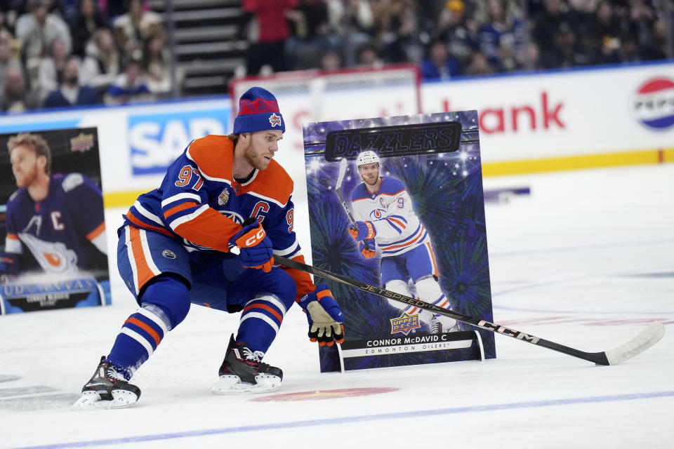 Edmonton Oilers' Connor McDavid navigates the course during the NHL All-Star hockey skills competition's stick handling section, in Toronto, Friday, Feb. 2, 2024. (Nathan Denette/The Canadian Press via AP)