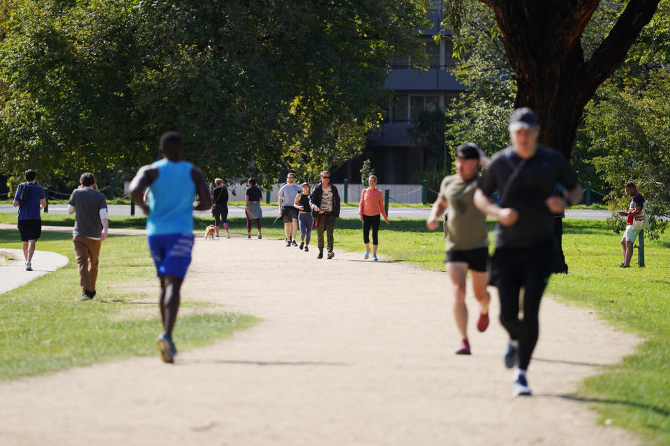 People exercise at Albert Park Lake in Melbourne. Source: AAP