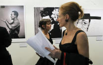 Visitors look around the Jazz exhibition during international Jazz Day at the UNESCO headquarters in Paris, Friday, April 27, 2012. (AP Photo/Jacques Brinon)