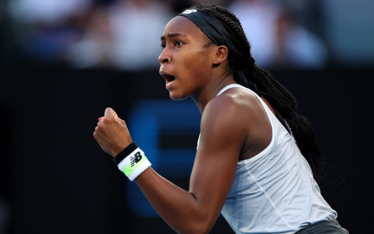 Coco Gauff of the United States celebrates after winning a point during her Women's Singles third round match against Naomi Osaka of Japan day five of the 2020 Australian Ope - Hannah Peters/Getty Images