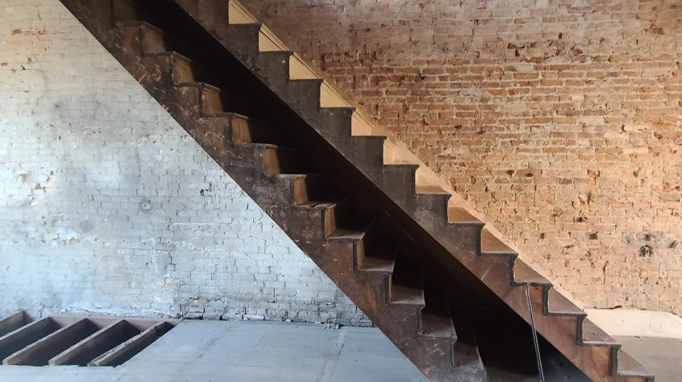 When renovating an old historic building you never know what you are fully getting until you demo the building and see the bare bones, for example, a staircase built on top of another staircase.