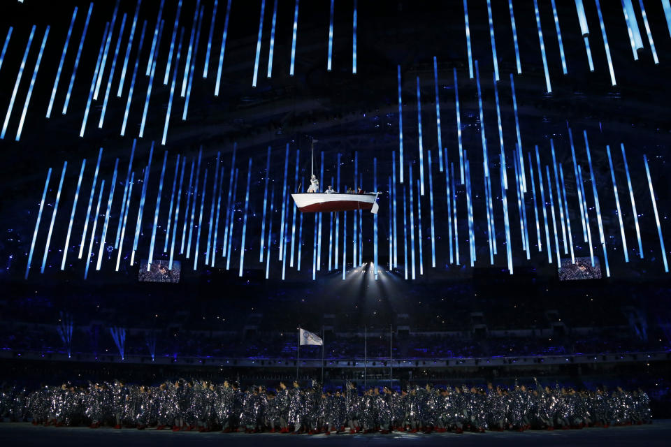 A boat is suspended in the air as performers participate in the closing ceremony of the 2014 Winter Olympics, Sunday, Feb. 23, 2014, in Sochi, Russia. (AP Photo/Darron Cummings)