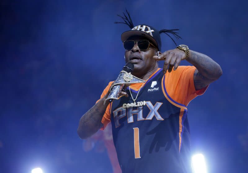 FILE - Coolio performs at halftime of an NBA basketball game between the Phoenix Suns and the New Orleans Pelicans on April 5, 2019, in Phoenix. Coolio, the rapper who was among hip-hop's biggest names of the 1990s with hits including "Gangsta's Paradise" and "Fantastic Voyage," died Wednesday, Sept. 28, 2022, at age 59, his manager said. (AP Photo/Rick Scuteri, File)