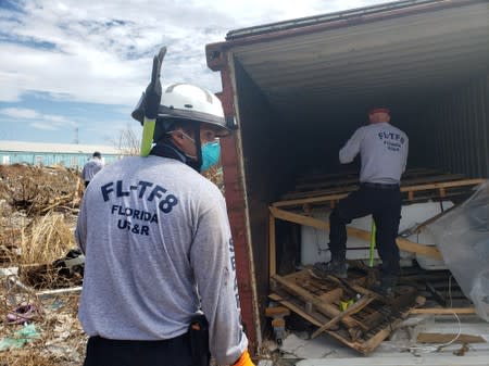 Chad Belger leads a search for the dead in the destroyed Abaco shantytown called Pigeon Peas