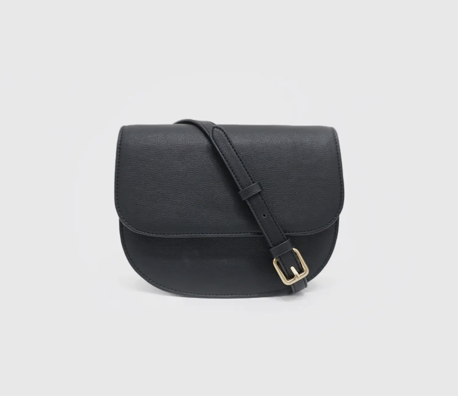 black vegan leather saddle bag with gold buckle