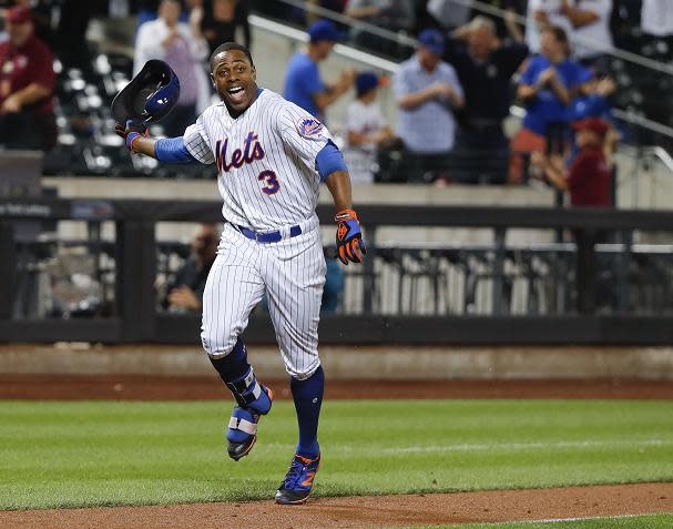Curtis Granderson celebrates his walk-off home run in the Mets 3-2 win against the Twins. (AP)