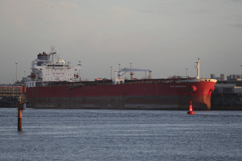 The Nave Andromeda oil tanker is docked next to the Queen Elizabeth II Cruise Terminal in Southampton, England, Monday, Oct. 26, 2020. The U.K. military seized control of the oil tanker that dropped anchor in the English Channel after reporting it had seven stowaways on board who had become violent. (Andrew Matthews/PA Wire via AP)