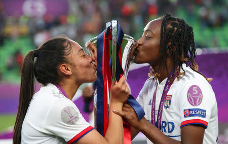 Soccer Football - Women's Champions League Final - Ferencvaros Stadium, Budapest, Hungary - May 18, 2019 Olympique Lyonnais' Selma Bacha and Griedge Mbock celebrate winning the Women's Champions League with the trophy REUTERS/Lisi Niesner TPX IMAGES OF THE DAY