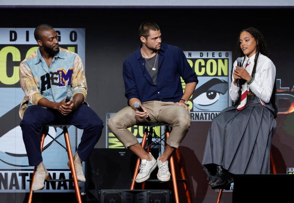 Aldis Hodge, Noah Centineo, and Quintessa Swindell speak onstage at the Warner Bros. theatrical panel