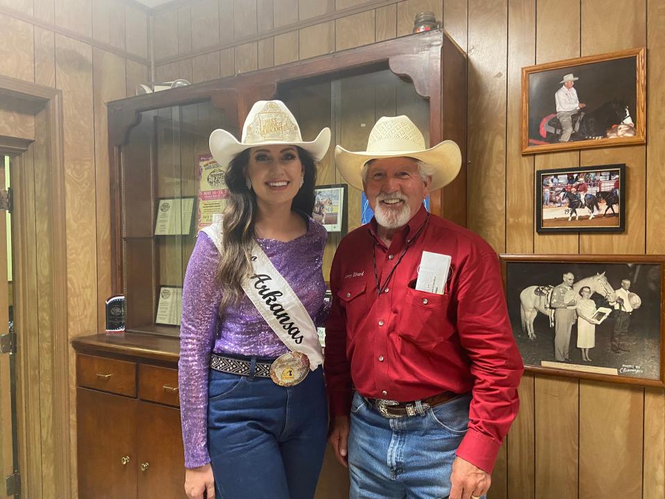 Molly Musick, Miss Rodeo Arkansas and Jerry Efurd, rodeo chairman pose for a photo after family night on June 1 at the Old Fort Days Rodeo.