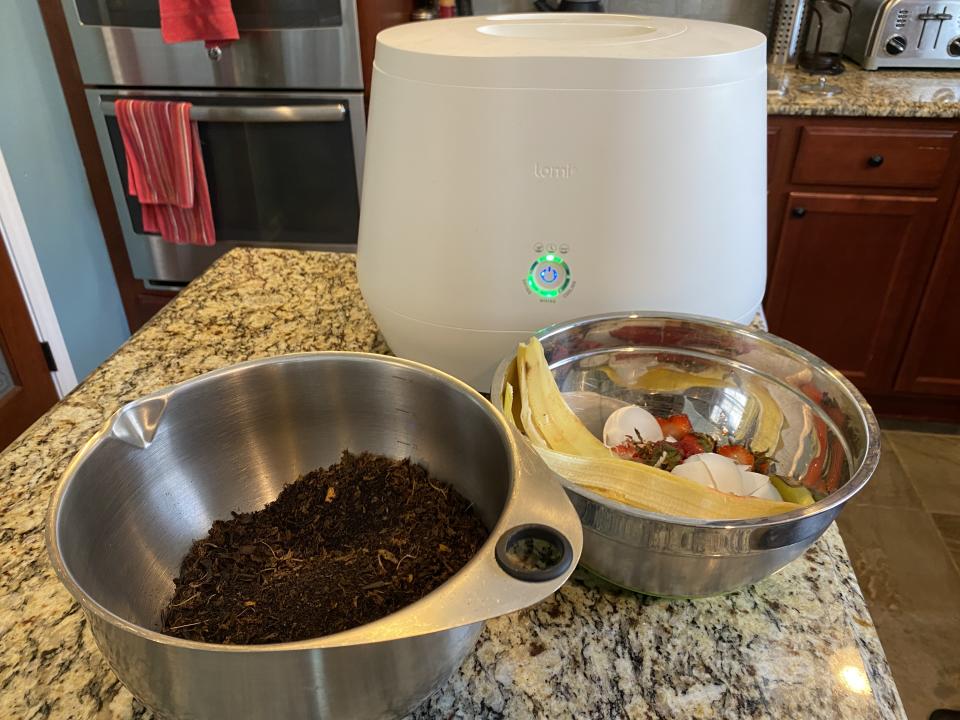 Lomi composting food waste on kitchen counter