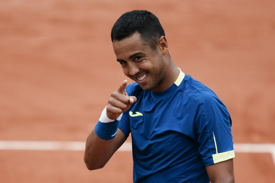 Bolivia's Hugo Dellien celebrates defeating Austria's Dominic Thiem in three sets, 6-3, 6-2, 6-4, in their first round match at the French Open tennis tournament in Roland Garros stadium in Paris, France, Sunday, May 22, 2022. (AP Photo/Thibault Camus)